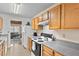 Kitchen boasts wood cabinets and granite countertops at 849 Hillandale Ln, Lithonia, GA 30058