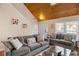 Living room with vaulted ceiling, hardwood floors, and cozy sofas at 849 Hillandale Ln, Lithonia, GA 30058