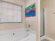 Main bathroom with soaking tub and walk-in shower at 849 Hillandale Ln, Lithonia, GA 30058