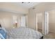 Main bedroom with large bed and access to bathroom and closets at 849 Hillandale Ln, Lithonia, GA 30058