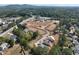 Aerial view of new home construction in a wooded community near roadways at 107 Winsome Way, Woodstock, GA 30188