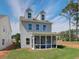 Charming backyard featuring a screened-in porch, perfect for enjoying the outdoors in comfort and style at 107 Winsome Way, Woodstock, GA 30188