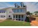 Two-story house with a screened porch and grassy backyard at 107 Winsome Way, Woodstock, GA 30188