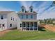 Enjoy outdoor living with a screened-in porch overlooking a spacious backyard and neighboring house at 107 Winsome Way, Woodstock, GA 30188