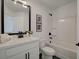 Clean bathroom with white vanity, tub, and black accents at 107 Winsome Way, Woodstock, GA 30188