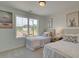 Bright bedroom with twin beds and a large window overlooking the neighborhood at 107 Winsome Way, Woodstock, GA 30188