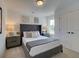 Cozy bedroom with tufted headboard and neutral decor at 107 Winsome Way, Woodstock, GA 30188