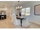 Elegant dining room with a large window and chandelier at 107 Winsome Way, Woodstock, GA 30188