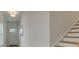 Bright entryway leading to the staircase, showcasing the home's clean lines and inviting atmosphere at 107 Winsome Way, Woodstock, GA 30188