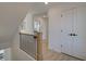 Upstairs hallway with light flooring and access to bedrooms at 107 Winsome Way, Woodstock, GA 30188