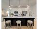 Modern kitchen with white cabinets, an island, and stainless steel appliances at 107 Winsome Way, Woodstock, GA 30188