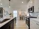 Modern kitchen with white cabinets and quartz countertops at 107 Winsome Way, Woodstock, GA 30188