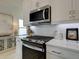 Modern kitchen featuring stainless steel appliances and white cabinets at 107 Winsome Way, Woodstock, GA 30188