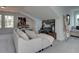 Spacious living room featuring a comfortable sofa, stylish décor, and natural lighting at 107 Winsome Way, Woodstock, GA 30188