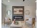 Cozy living room featuring a modern fireplace and comfortable seating, perfect for relaxation and gatherings at 107 Winsome Way, Woodstock, GA 30188