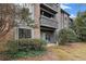 Inviting condo featuring balconies and complemented by mature landscaping at 320 Tuxworth Cir, Decatur, GA 30033