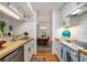 Bright kitchen with butcher block countertops and dining room view at 320 Tuxworth Cir, Decatur, GA 30033