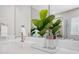 Close up of a modern bathroom countertop with a stylish faucet and decorative plant at 3335 Park Pointe Cir, Scottdale, GA 30079