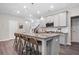 Modern kitchen featuring a granite island, stainless steel appliances, and pendant lighting over breakfast bar seating at 3335 Park Pointe Cir, Scottdale, GA 30079