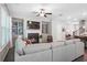 Comfortable living room with a fireplace, built-in shelves, ceiling fan, and natural light from the windows at 3335 Park Pointe Cir, Scottdale, GA 30079