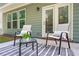 Cozy patio with outdoor seating, pillows, rug, and exterior door at 3335 Park Pointe Cir, Scottdale, GA 30079