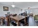 Open concept dining room with seating for six and a view into the living room at 4646 Biffle Rd, Stone Mountain, GA 30088