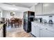 Kitchen features granite countertops, gray cabinets, and stainless steel appliances at 4646 Biffle Rd, Stone Mountain, GA 30088