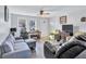 Living room with gray sectional sofa and hardwood floors at 4646 Biffle Rd, Stone Mountain, GA 30088