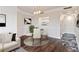 Bright dining area with modern lighting, view to kitchen and access to the entry at 1 Biscayne Nw Dr # 809, Atlanta, GA 30309