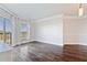 Bright living room featuring hardwood floors, modern lighting, and sliding glass doors leading to a balcony at 1 Biscayne Nw Dr # 809, Atlanta, GA 30309