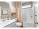 Bright bathroom featuring a vanity with sink, toilet, and shower-tub combination at 120 Asher Dr, Carrollton, GA 30116