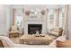 Cozy living room with fireplace and decorative accents, with sun-drenched windows at 120 Asher Dr, Carrollton, GA 30116