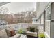 Relaxing balcony featuring patio furniture, white railings, and scenic views at 204 Natchez Trce, Sandy Springs, GA 30350