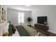 Spacious bedroom featuring plush bedding, modern decor, and ample natural light at 204 Natchez Trce, Sandy Springs, GA 30350