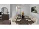 Elegant dining room with seating for eight, modern decor, and wood flooring at 204 Natchez Trce, Sandy Springs, GA 30350