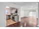 Open concept kitchen flowing into a living area with modern appliances and granite counters at 204 Natchez Trce, Sandy Springs, GA 30350