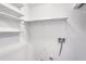 Bright laundry room with shelving and washer hookups at 204 Natchez Trce, Sandy Springs, GA 30350