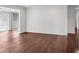 Living room featuring hardwood floors, a sliding glass door, and neutral paint colors at 204 Natchez Trce, Sandy Springs, GA 30350