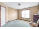 Bedroom with neutral walls, carpet flooring, a large window and some furniture at 775 River Cliff Ct, Suwanee, GA 30024