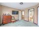 Bedroom with neutral walls, carpet flooring, a large window and doors leading to other rooms at 775 River Cliff Ct, Suwanee, GA 30024