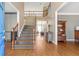 Spacious foyer showcases hardwood floors, a staircase, and views to the upper level at 775 River Cliff Ct, Suwanee, GA 30024