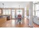 Bright kitchen featuring dining nook, stainless steel appliances, and hardwood flooring at 775 River Cliff Ct, Suwanee, GA 30024