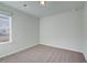 Upstairs bedroom with carpet, neutral walls, and window at 317 Heavenly Hollow Pl, Mcdonough, GA 30253