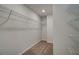 Spacious walk-in closet with wire shelving and neutral carpeting at 317 Heavenly Hollow Pl, Mcdonough, GA 30253