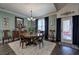 Traditional dining room featuring hardwood floors, a round wooden table, and elegant chandelier at 35 Berryhill Se Pl, Cartersville, GA 30121