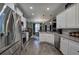 Modern kitchen with stainless steel appliances and granite countertops open to dining area at 35 Berryhill Se Pl, Cartersville, GA 30121