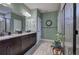 This is a very large ensuite bathroom with a double vanity, walk-in shower, and lots of floor space at 35 Berryhill Se Pl, Cartersville, GA 30121