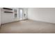 A bright bedroom with natural light, neutral carpet, and floating shelves at 607 Broadview Ter, Atlanta, GA 30324