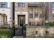 Charming brick townhome with a manicured front yard, an inviting entryway, and a decorative stone wall at 607 Broadview Ter, Atlanta, GA 30324