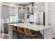 Modern kitchen featuring stainless steel appliances, a large island with seating, and pendant lighting at 607 Broadview Ter, Atlanta, GA 30324